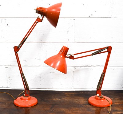 Lot 275 - A pair of mid-century orange anglepoise lamps.