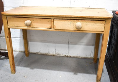 Lot 311 - An antique two drawer pine table with 74 by...