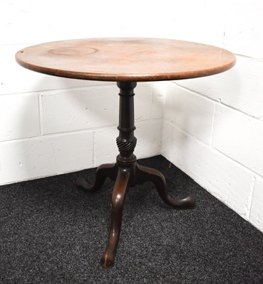 Lot 312 - A 19th century mahogany tilt top table with...