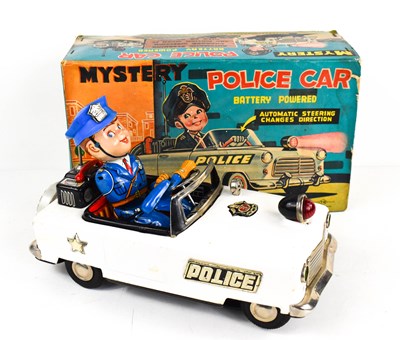 Lot 345 - A vintage tinplate Mystery Police Car, battery...