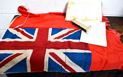 Lot 114 - A flag and a cabin light from the ship...