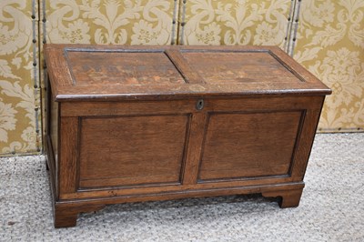 Lot 325 - A 19th century oak coffer, with twin panel lid...