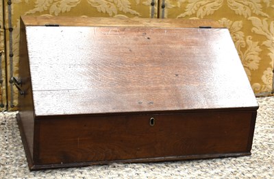 Lot 319 - An early 19th century oak desk box, the fall...