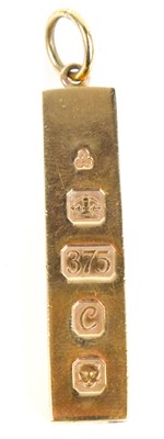 Lot 121 - A 9ct gold ingot pendant, hallmarked for...