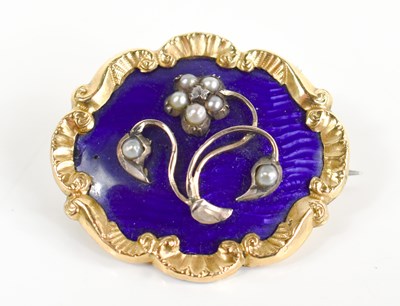 Lot 5 - A Victorian gold and blue enamel brooch with...