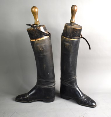 Lot 239 - A pair of antique black leather riding boots...