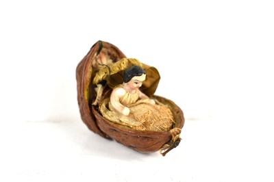 Lot 211 - A 19th century miniature porcelain doll in a...