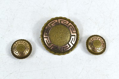Lot 128 - A brooch and neck button set, with gold Greek...