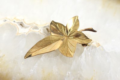 Lot 207 - A 9ct gold brooch in the form of a maple leaf,...