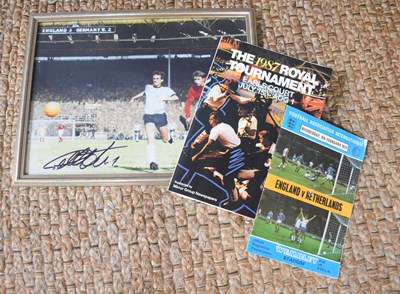 Lot 292 - A framed and glazed football photograph signed...