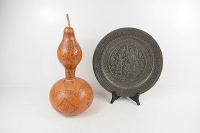 Lot 255 - A North African gourd seed pod, engraved with...