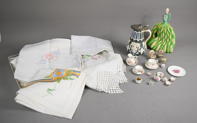 Lot 218 - A vintage porcelain doll top with knitted...