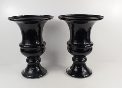 Lot 64 - A pair of modern black glass urn vases in the...