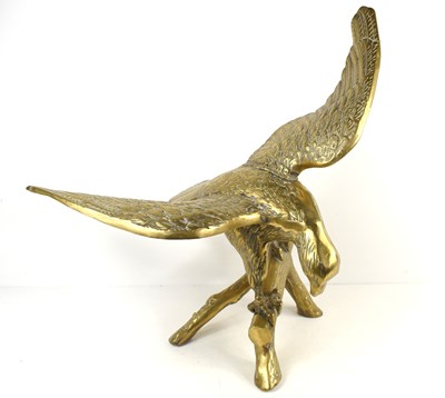 Lot 344 - A large brass model of an eagle perching on a...