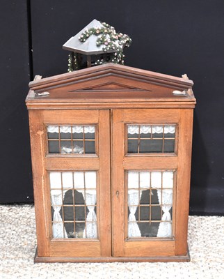 Lot 303 - An early 20th century dolls house comprising...