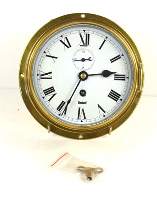 Lot 123 - A Sestral brass cased ship's bulkhead clock,...