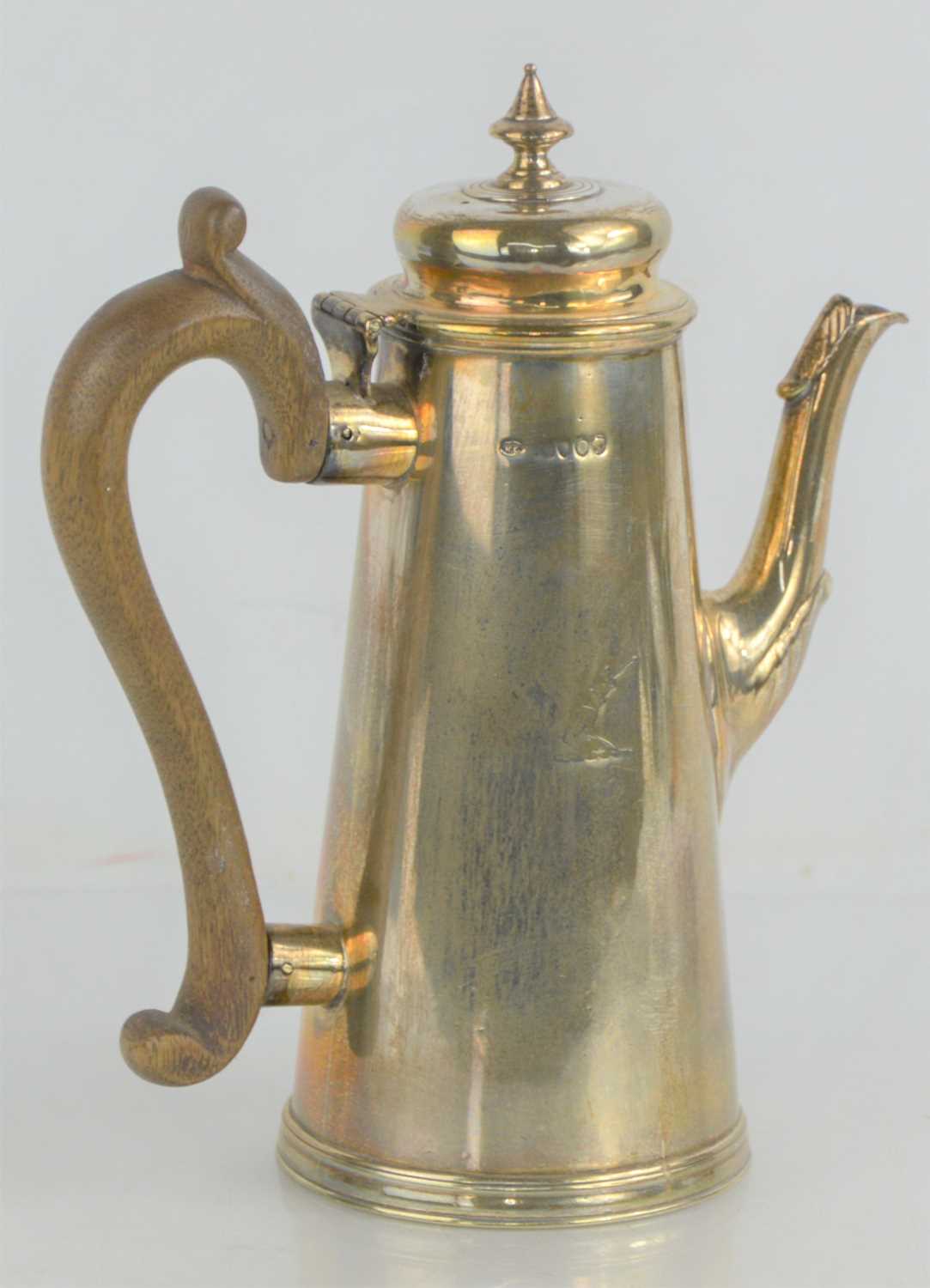 Lot 36 - A Victorian silver coffee pot with fruitwood...