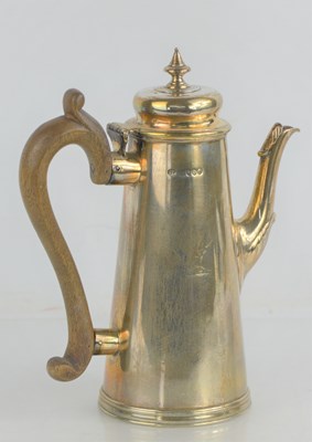 Lot 36 - A Victorian silver coffee pot with fruitwood...