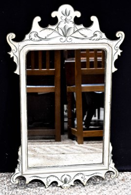 Lot 252 - A painted fretwork wall mirror, white ground...