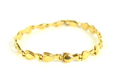 Lot 246 - An 18ct gold bracelet, with fancy links hinged,...