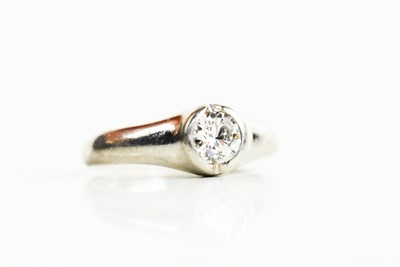 Lot 232 - A platinum and diamond solitaire ring, the...