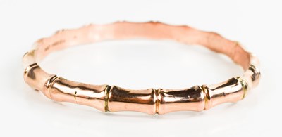Lot 103 - A 9ct rose gold bamboo style bangle, marked...