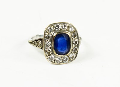 Lot 98 - An 18ct white gold, sapphire and diamond ring,...