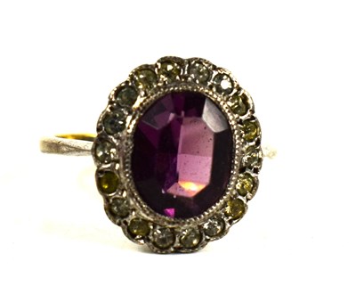 Lot 138 - A 9ct gold, amethyst and paste ring, the oval...