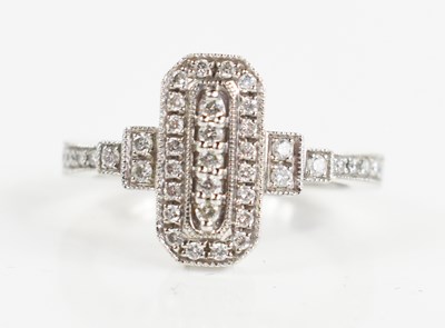 Lot 196 - A 9ct white gold and diamond cluster ring, the...