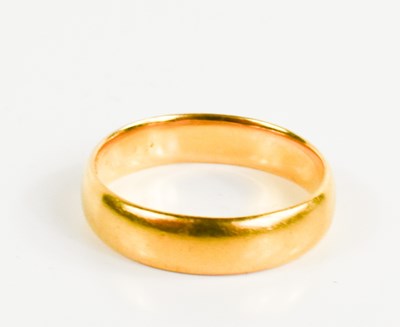 Lot 237 - A 22ct gold wedding band, size N, 5g.