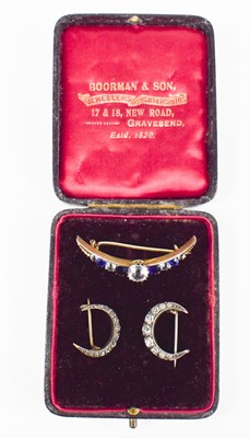 Lot 248 - Three crescent moon brooches: a gilt metal...