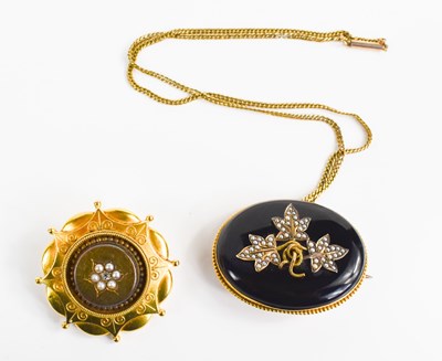 Lot 182 - Two Victorian mourning brooches: one set with...