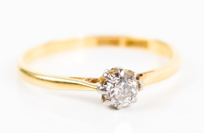 Lot 220 - An 18ct gold and diamond solitaire ring, the...