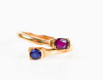 Lot 25 - A 9ct gold, ruby and sapphire cross over...