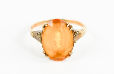 Lot 180 - A 9ct gold and citrine ring, the oval cut...