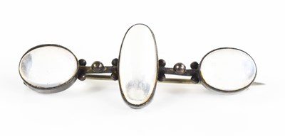 Lot 230 - A silver & moonstone brooch, the three oval...