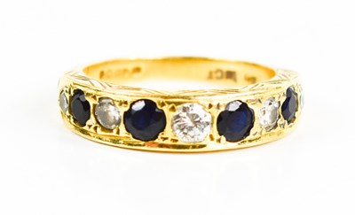 Lot 189 - A 9ct gold, diamond and sapphire ring, the...