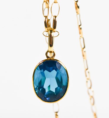 Lot 192 - A 9ct gold and topaz pendant necklace, the...