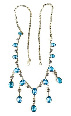 Lot 123 - A white metal, blue topaz and white sapphire...