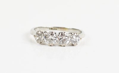 Lot 58 - An 18ct white gold and four stone diamond ring,...