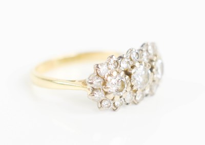 Lot 221 - An 18ct gold and diamond ring, the central...