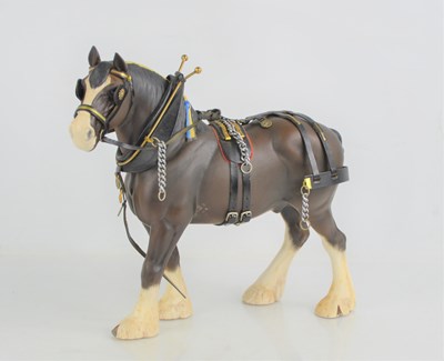 Lot 127 - A large Beswick shire horse with harness,...