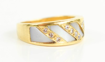 Lot 150 - A gold, mother of pearl and diamond ring, the...