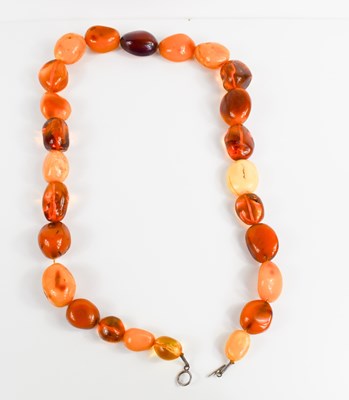 Lot 216 - An amber necklace, composed of butterscotch...