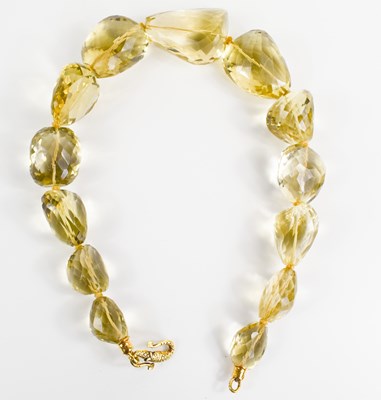 Lot 209 - A large quartz beaded necklace, each boulder...