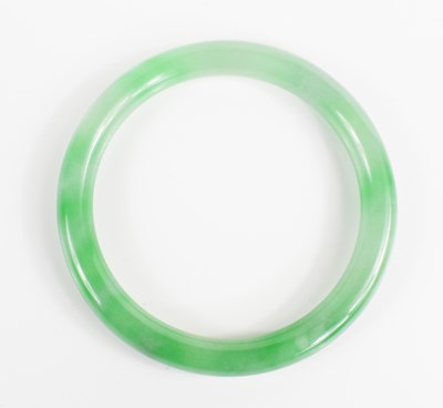 Lot 269 - A Chinese jade bangle of plain circular form,...