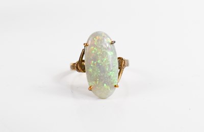 Lot 50 - A gold and opal ring, the oval cabochon opal...