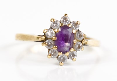 Lot 159 - A 9ct gold, amethyst and diamond flowerhead...