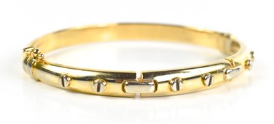 Lot 126 - A 9ct gold Italian bangle, in the Cartier...