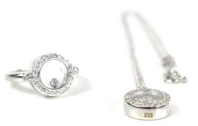 Lot 52 - An 18ct white gold demi parure set in the...
